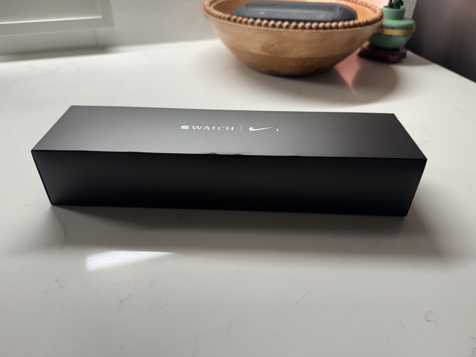 Apple Watch Series 4 Nike+ 44 mm Silver Aluminum Case with pure Plat/Black band.
