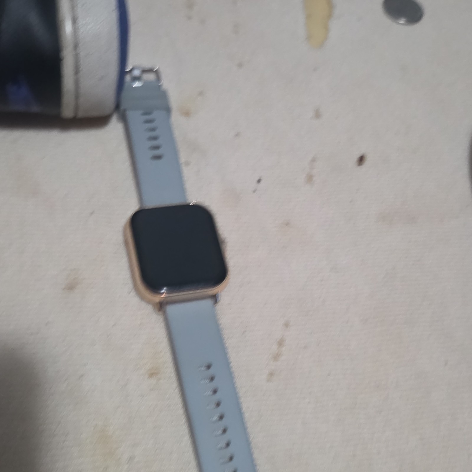 Smart Watch with Square Face Gold Case Gray Silicone Band Modern Stylish Design