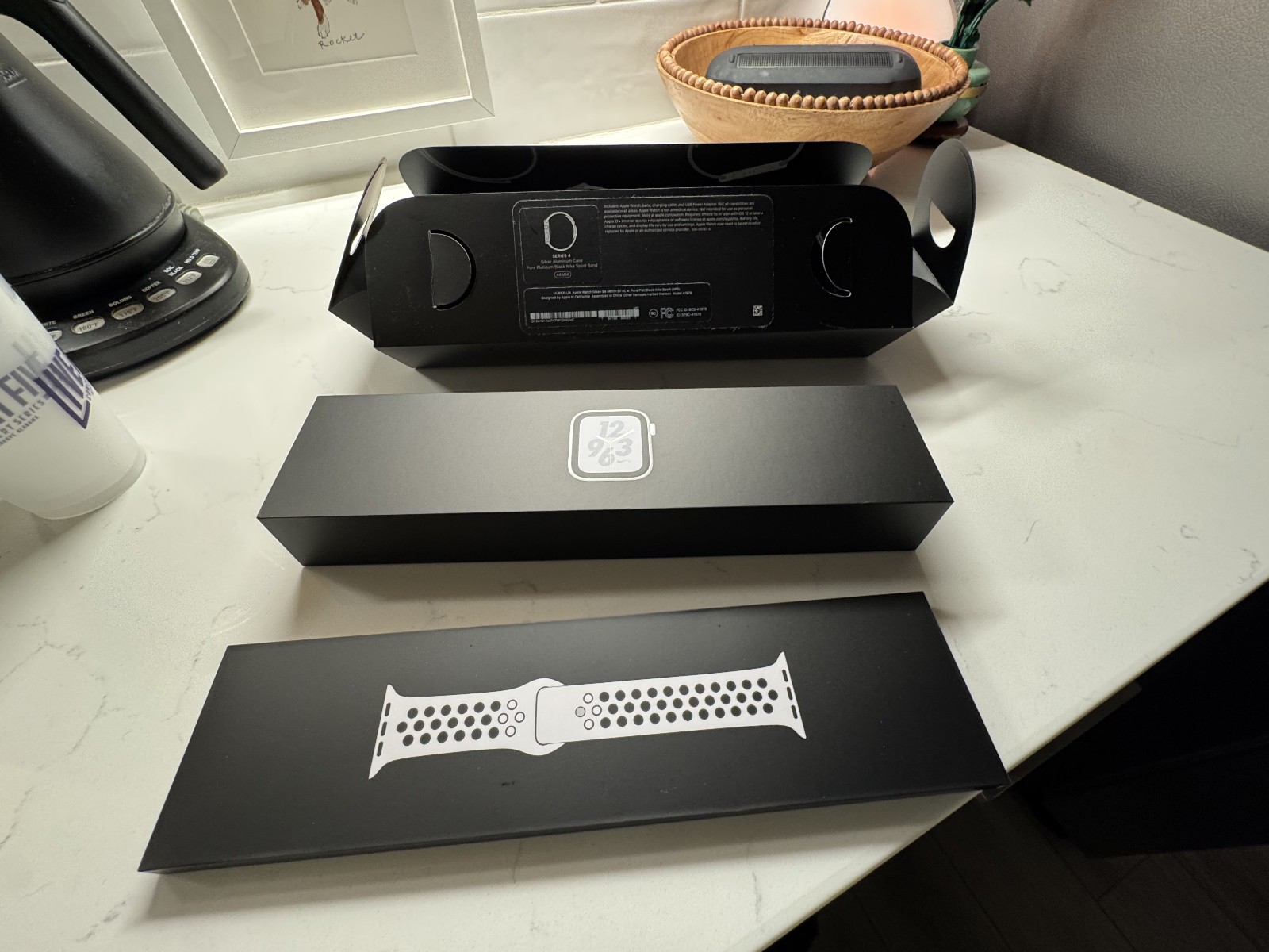 Apple Watch Series 4 Nike+ 44 mm Silver Aluminum Case with pure Plat/Black band.