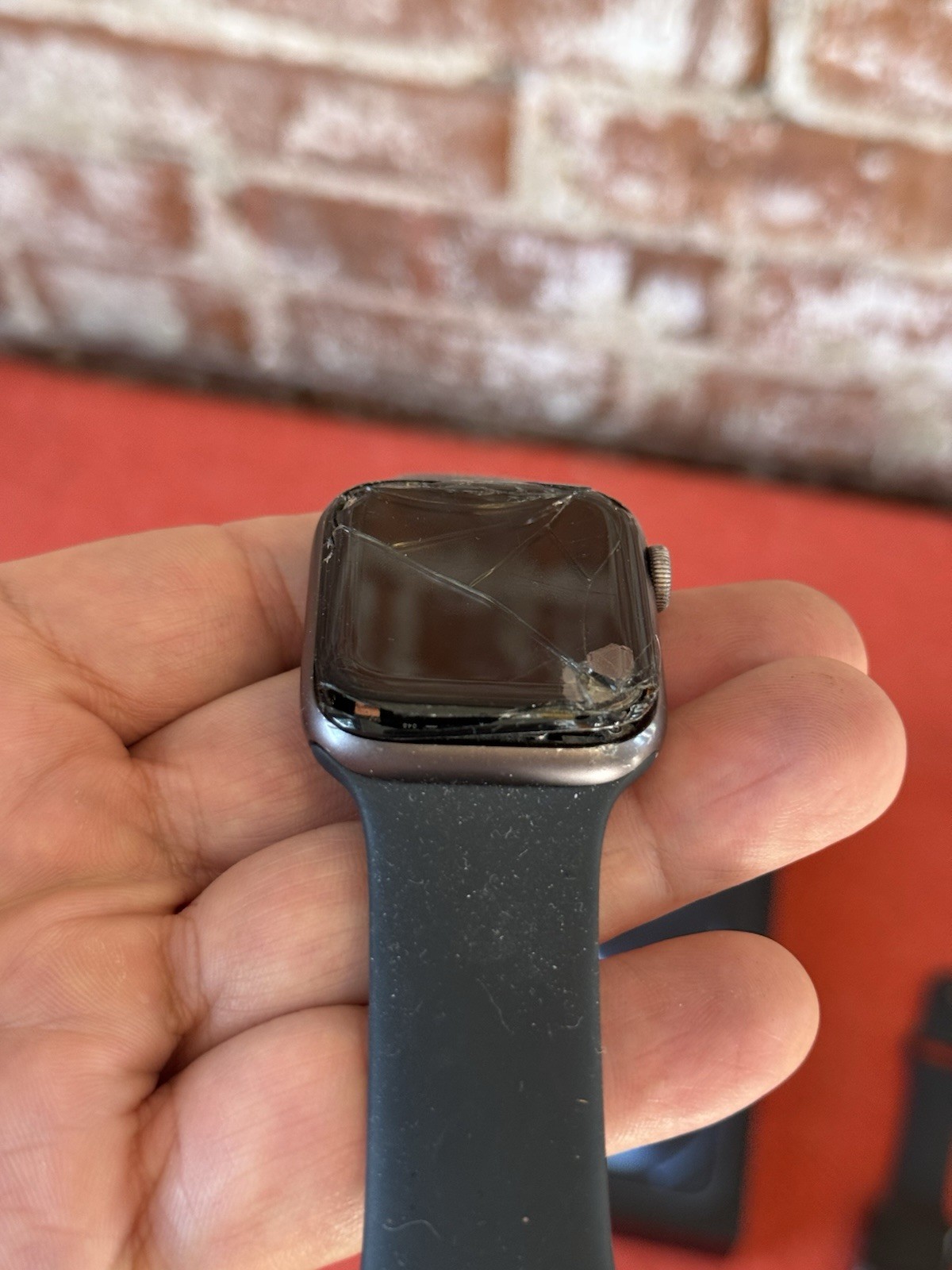 Two apple iPhones and two Apple Watches parts non working storage unit find