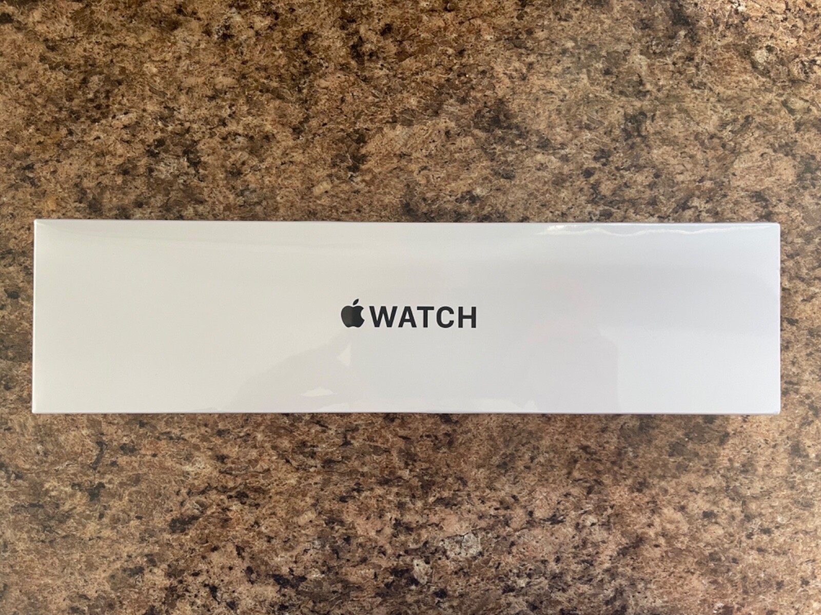 Apple Watch SE 40mm with Silver Aluminum Case and Abyss Blue Sport Band.