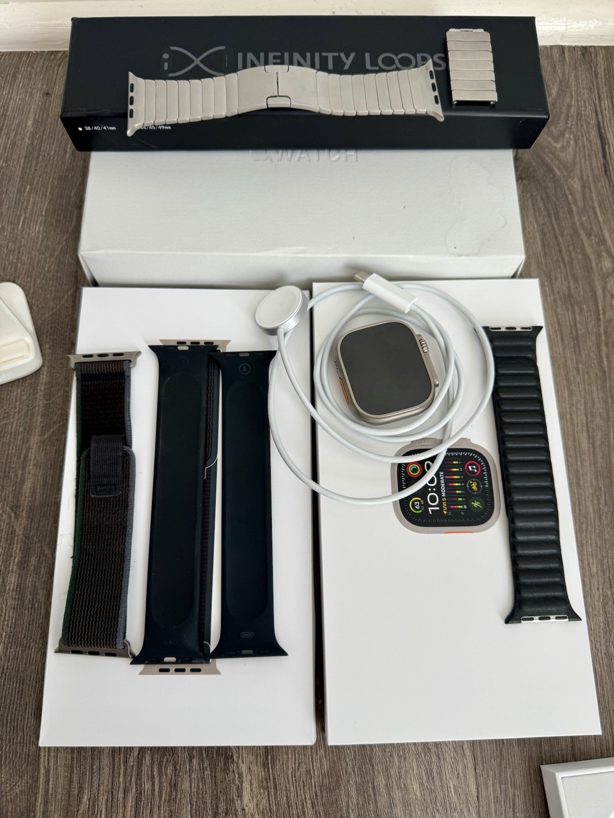 Apple Watch Ultra 2 49mm Titanium + Titanium, Leather, Loop Bracelets