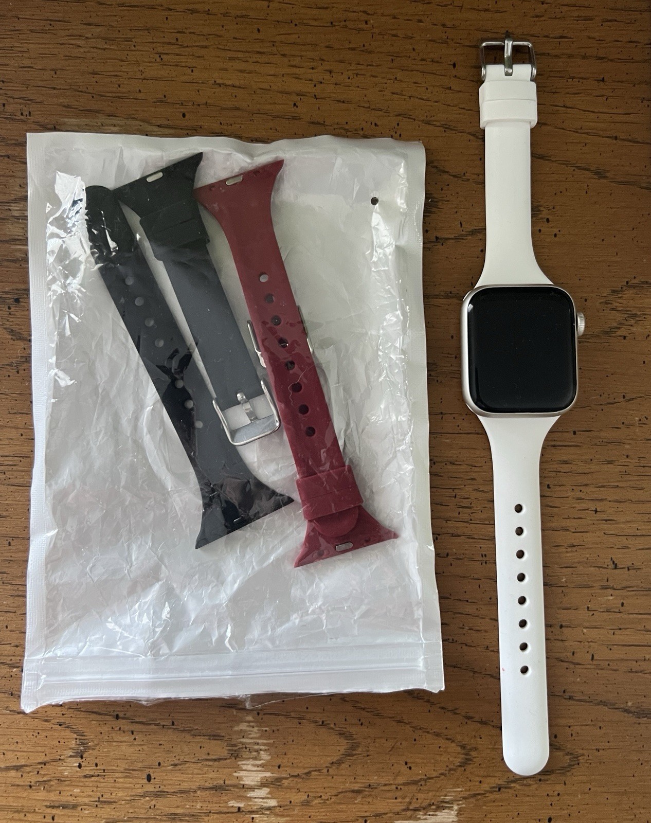 AT&T Apple Watch SE 2 40mm Starlight Aluminum 3 Bands White, Black, and Maroon.