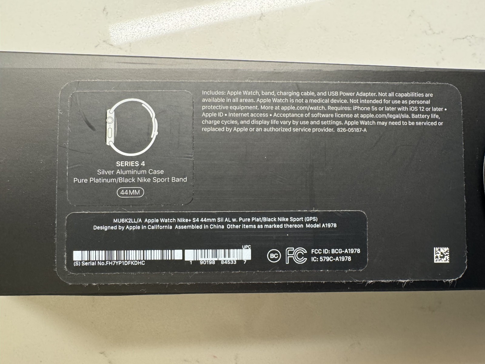 Apple Watch Series 4 Nike+ 44 mm Silver Aluminum Case with pure Plat/Black band.